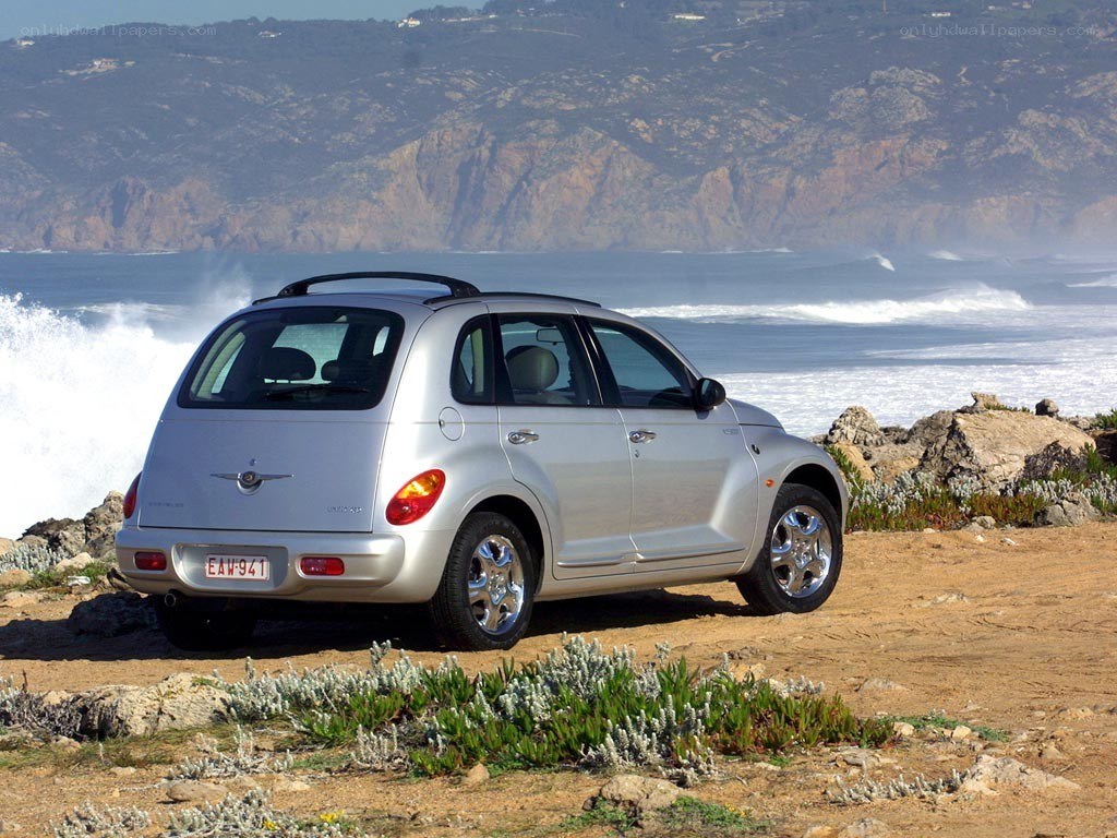 Silver car on coastal cliff