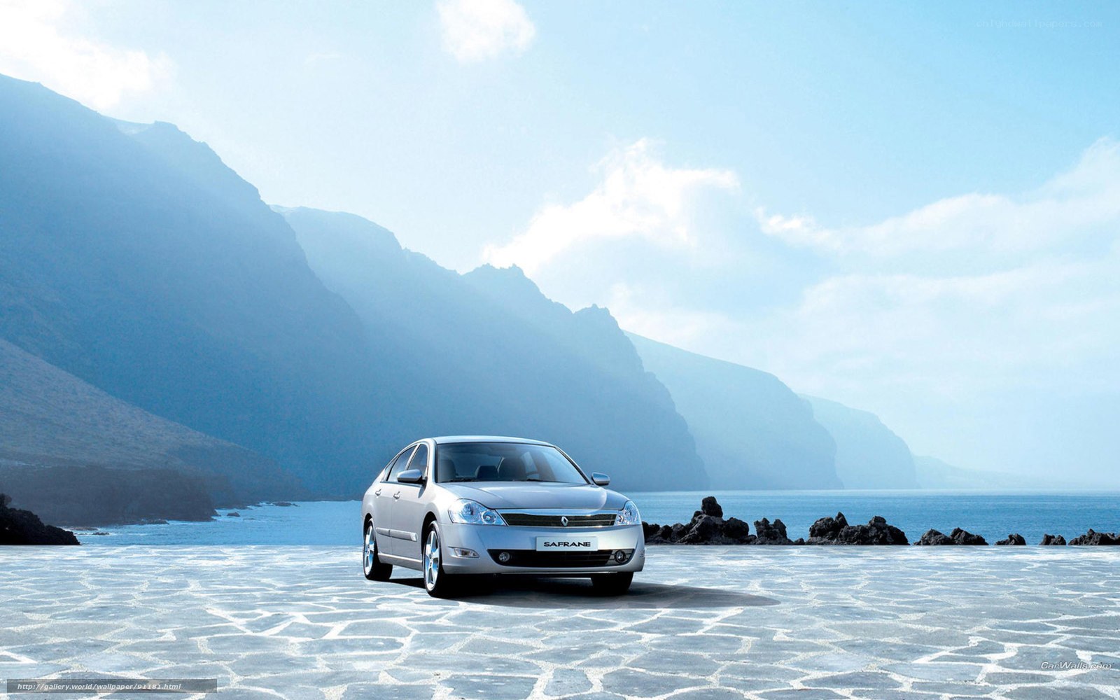 Silver car on coastal pavement