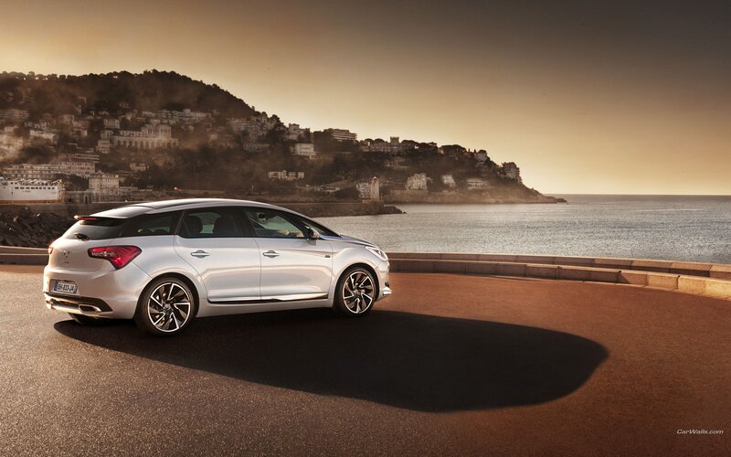 Silver car on coastal road