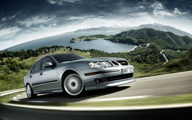 Silver car on coastal road