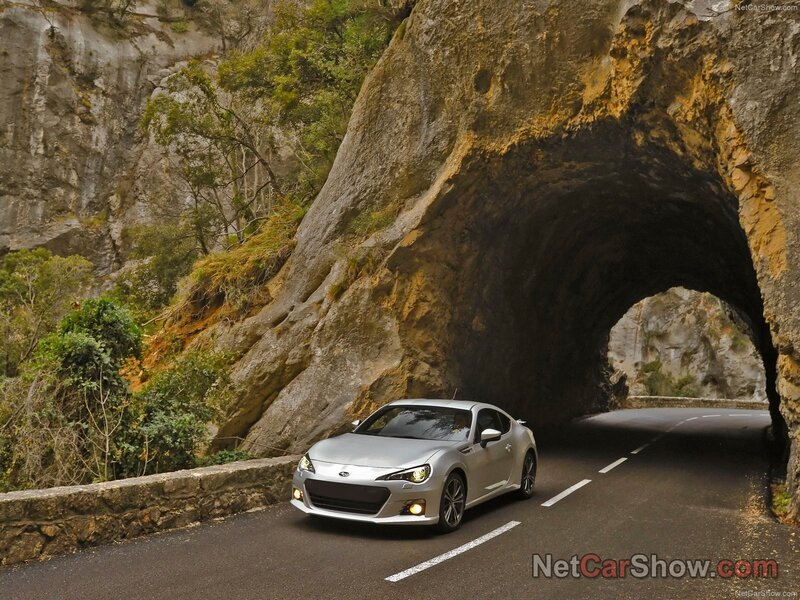 Silver car on coastal road