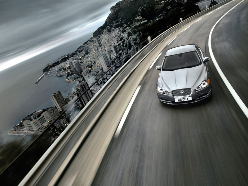 Silver car on coastal road