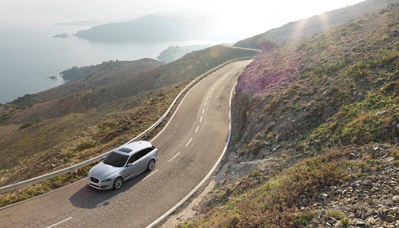 Silver car on coastal road