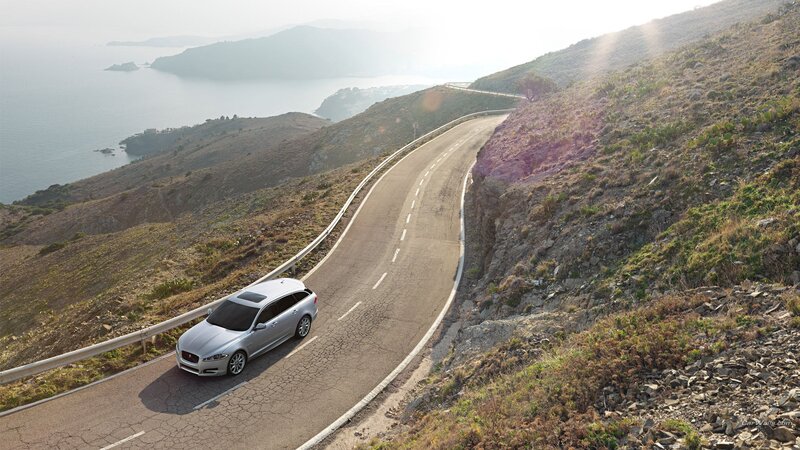Silver Car on Coastal Road — Gray