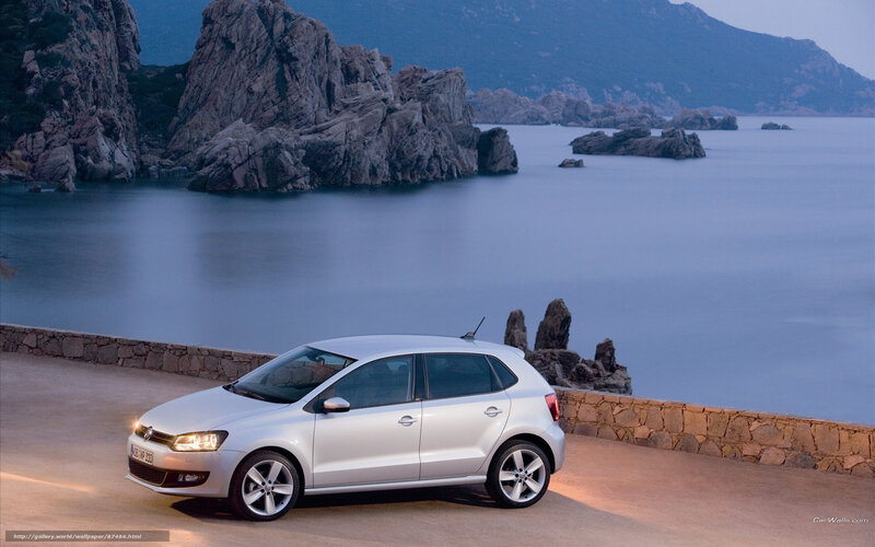 Silver car on coastal road