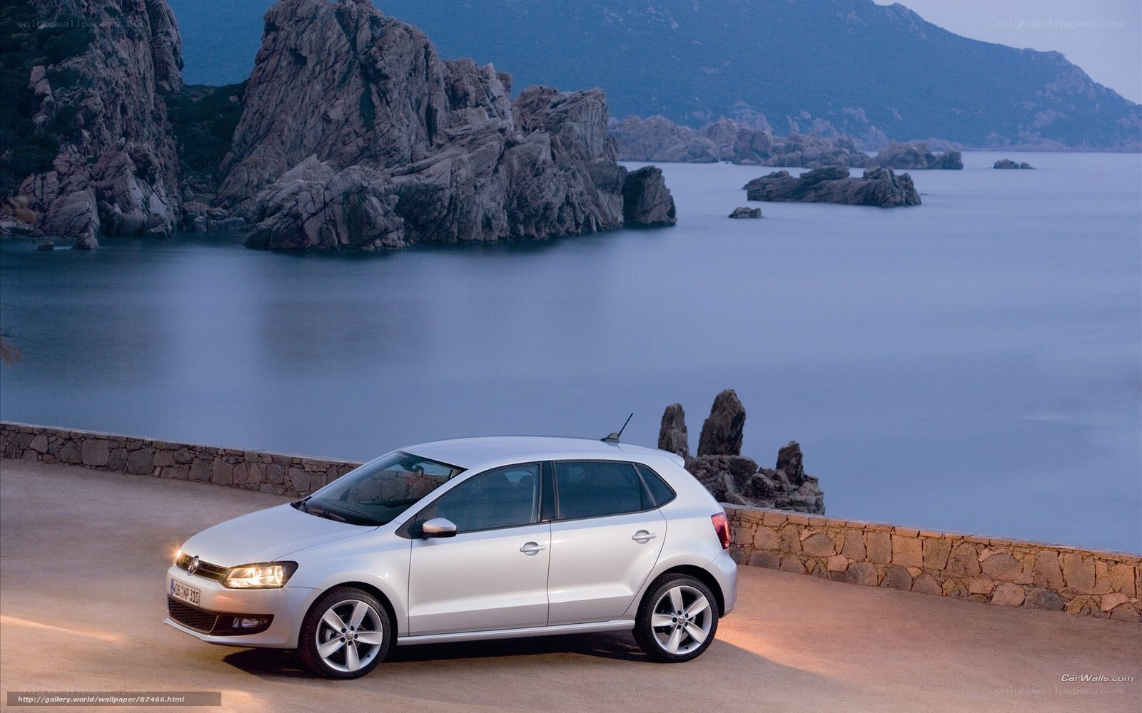 Silver car on coastal road