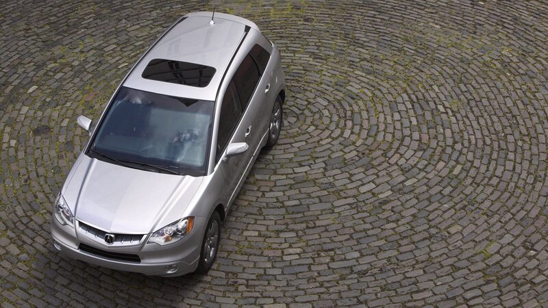 silver car on cobblestone