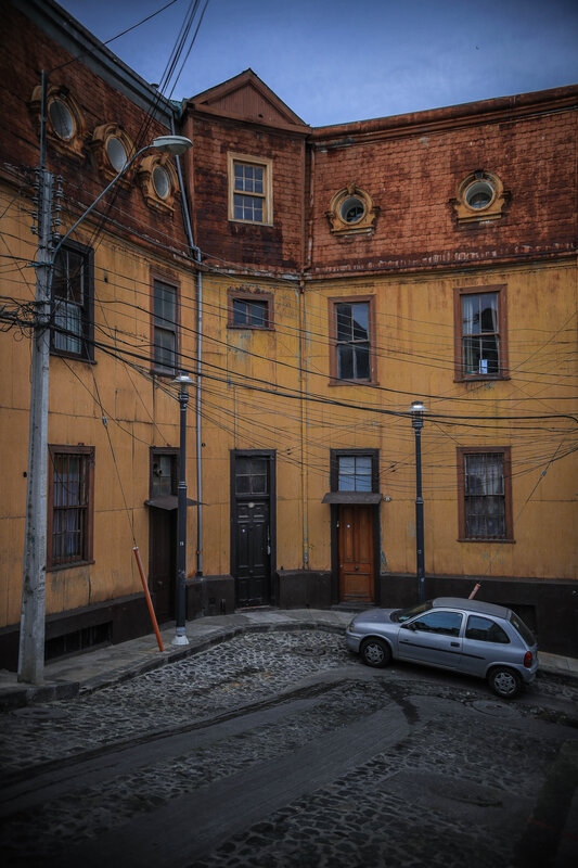 Silver Car on Cobblestone Street — Yellow