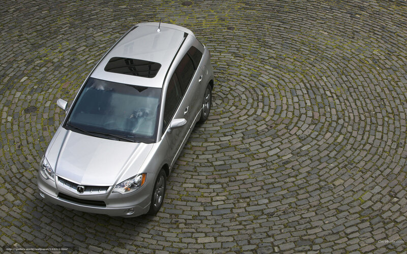 silver car on cobblestone
