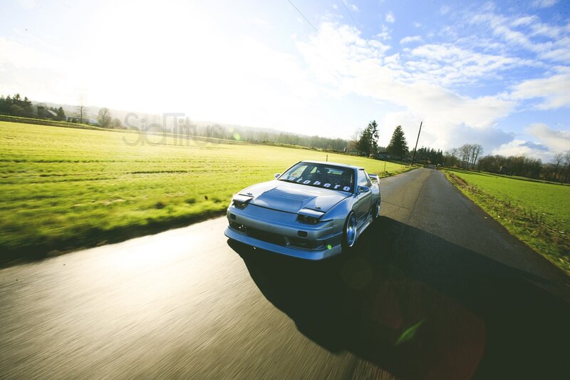 Silver car on country road