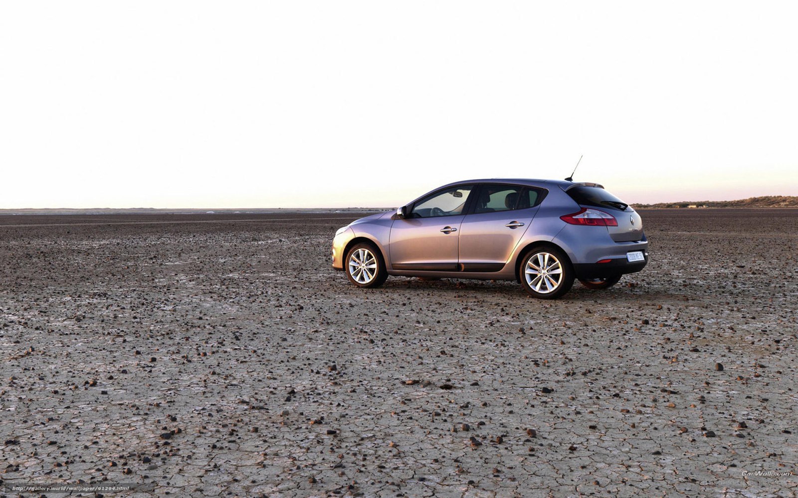 silver car on cracked earth