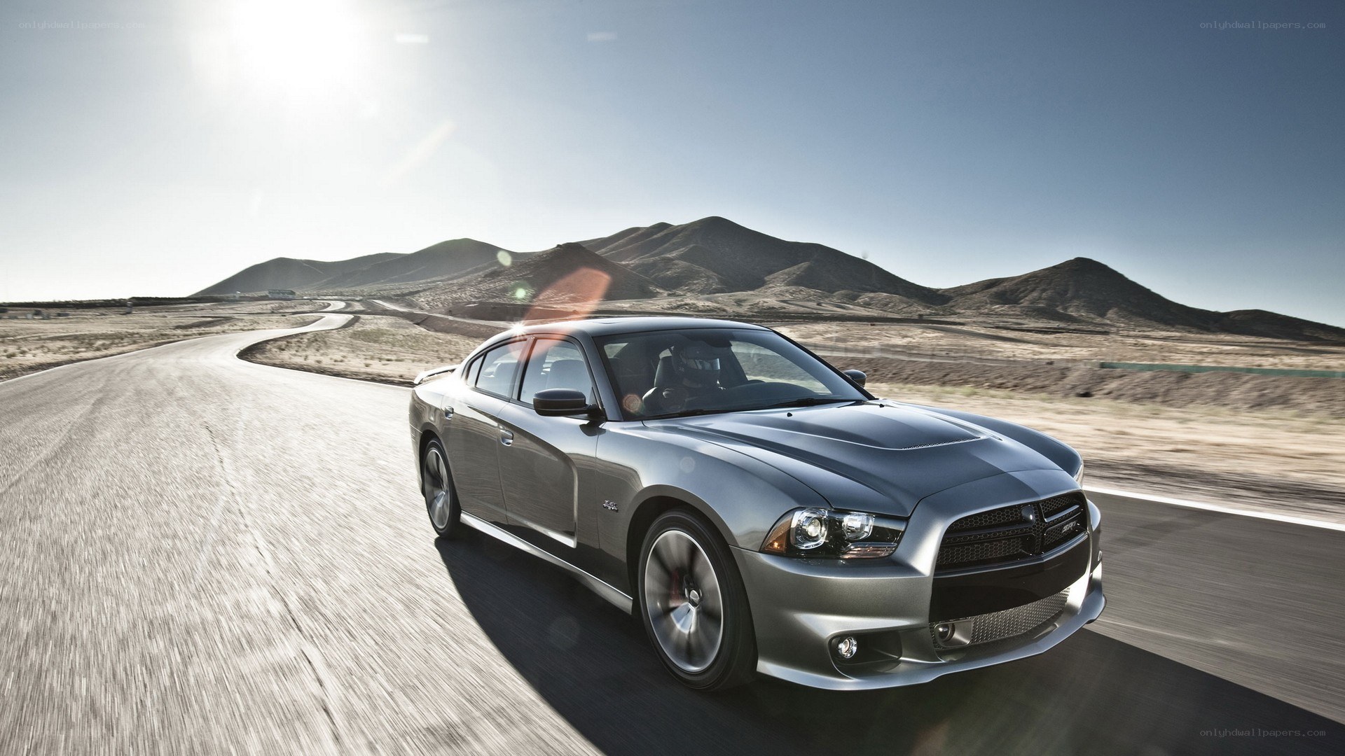 silver car on desert road