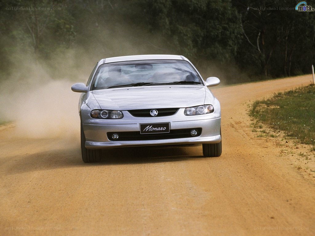 silver car on dirt road