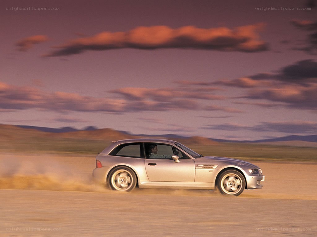 silver car on dusty road