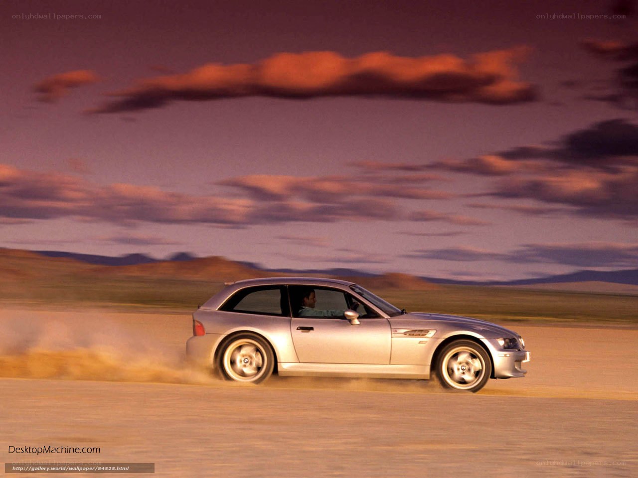 silver car on dusty road