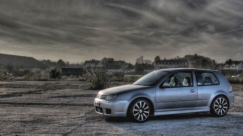 Silver car on gravel lot