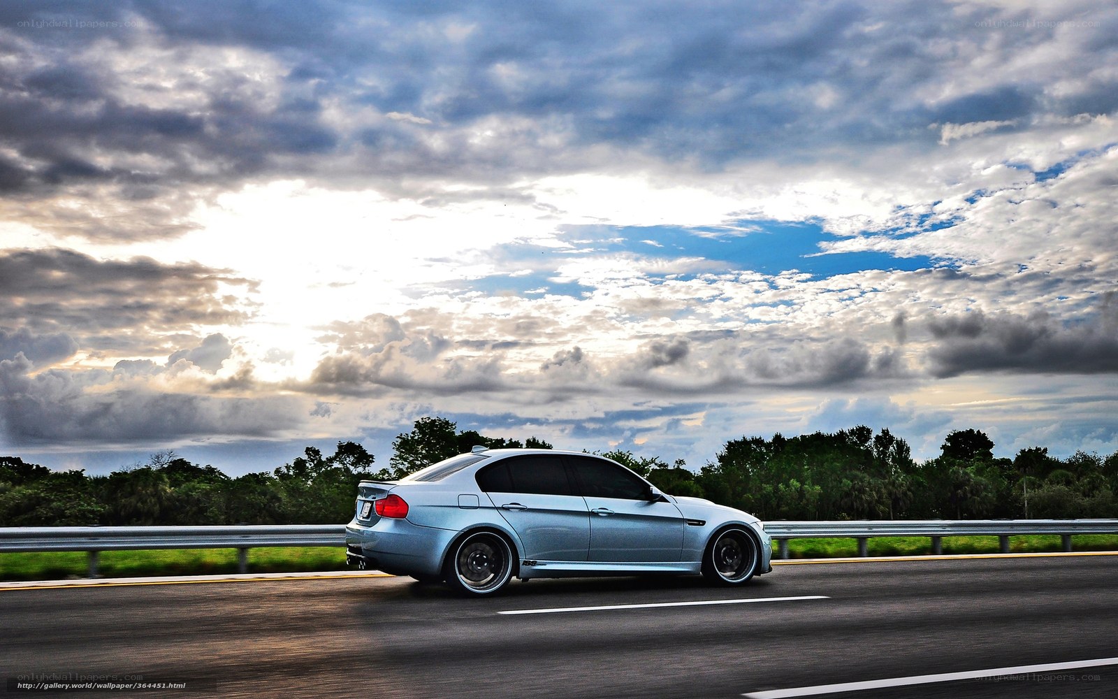 silver car on highway at sunset