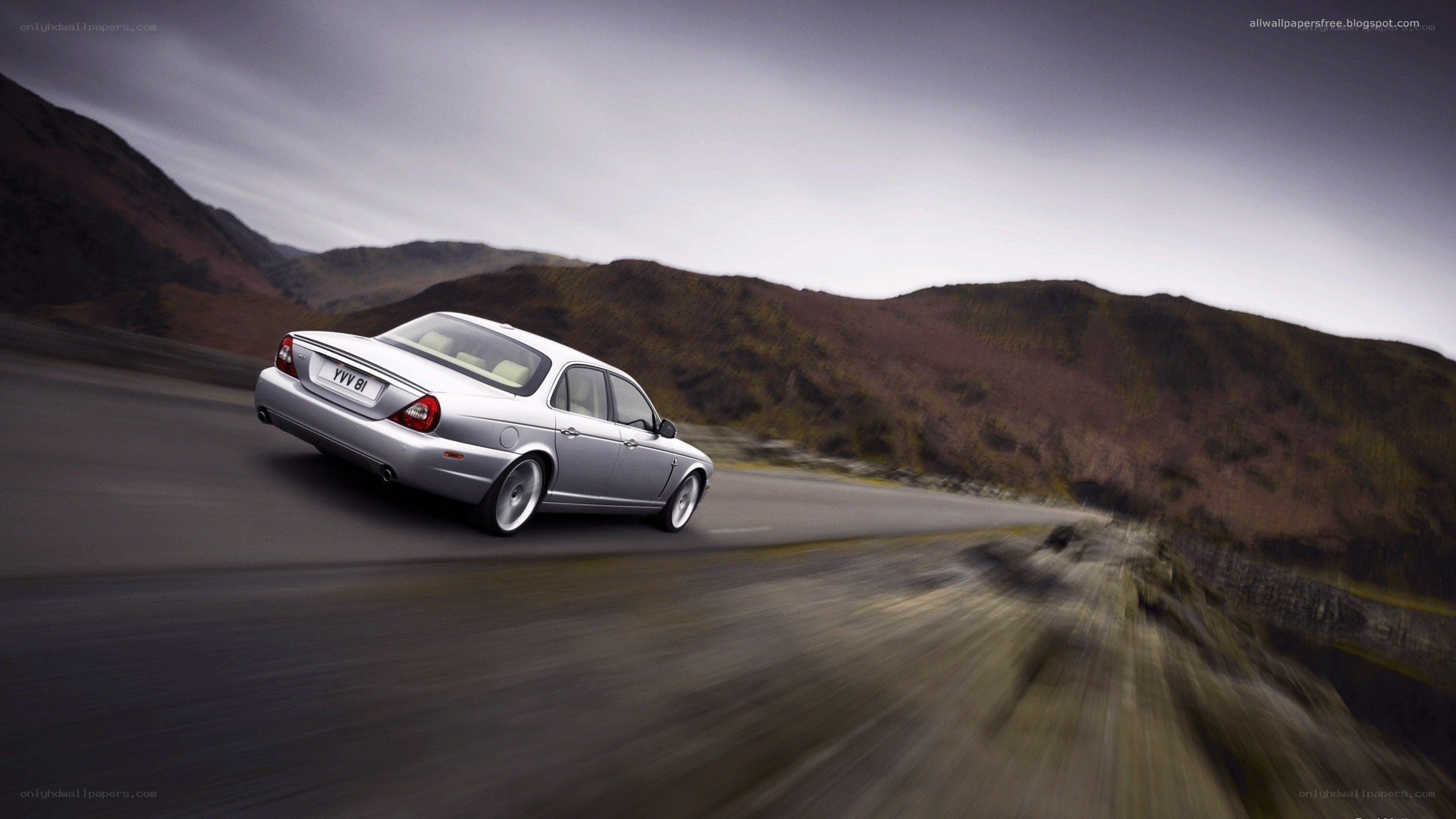 silver car on mountain road