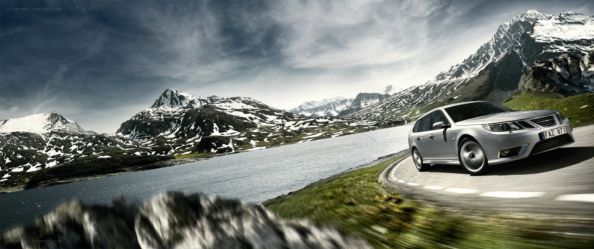 Silver car on mountain road