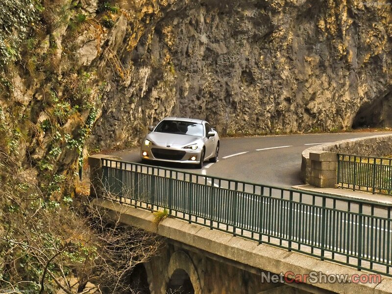 Silver car on mountain road