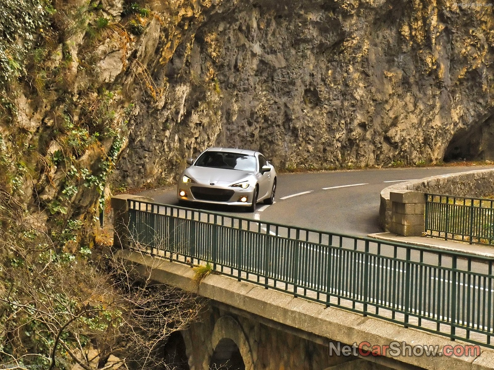 Silver car on mountain road