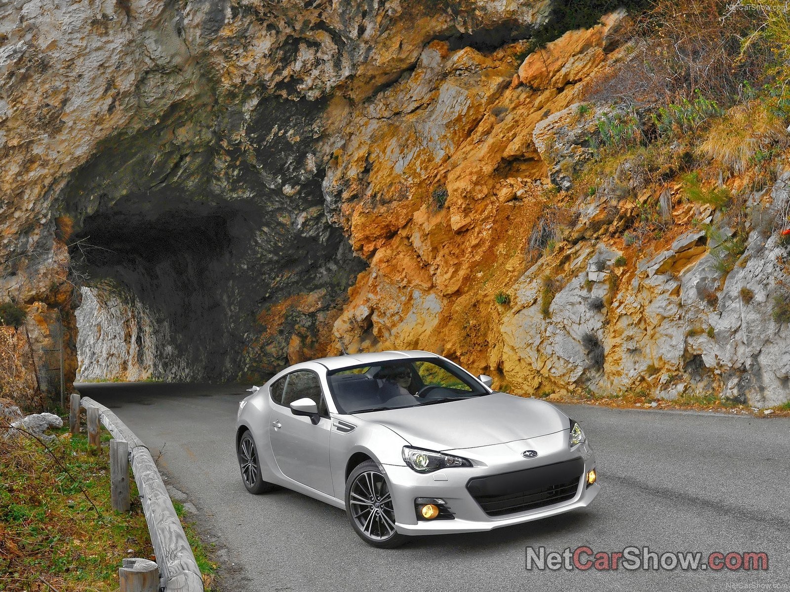 Silver car on mountain road