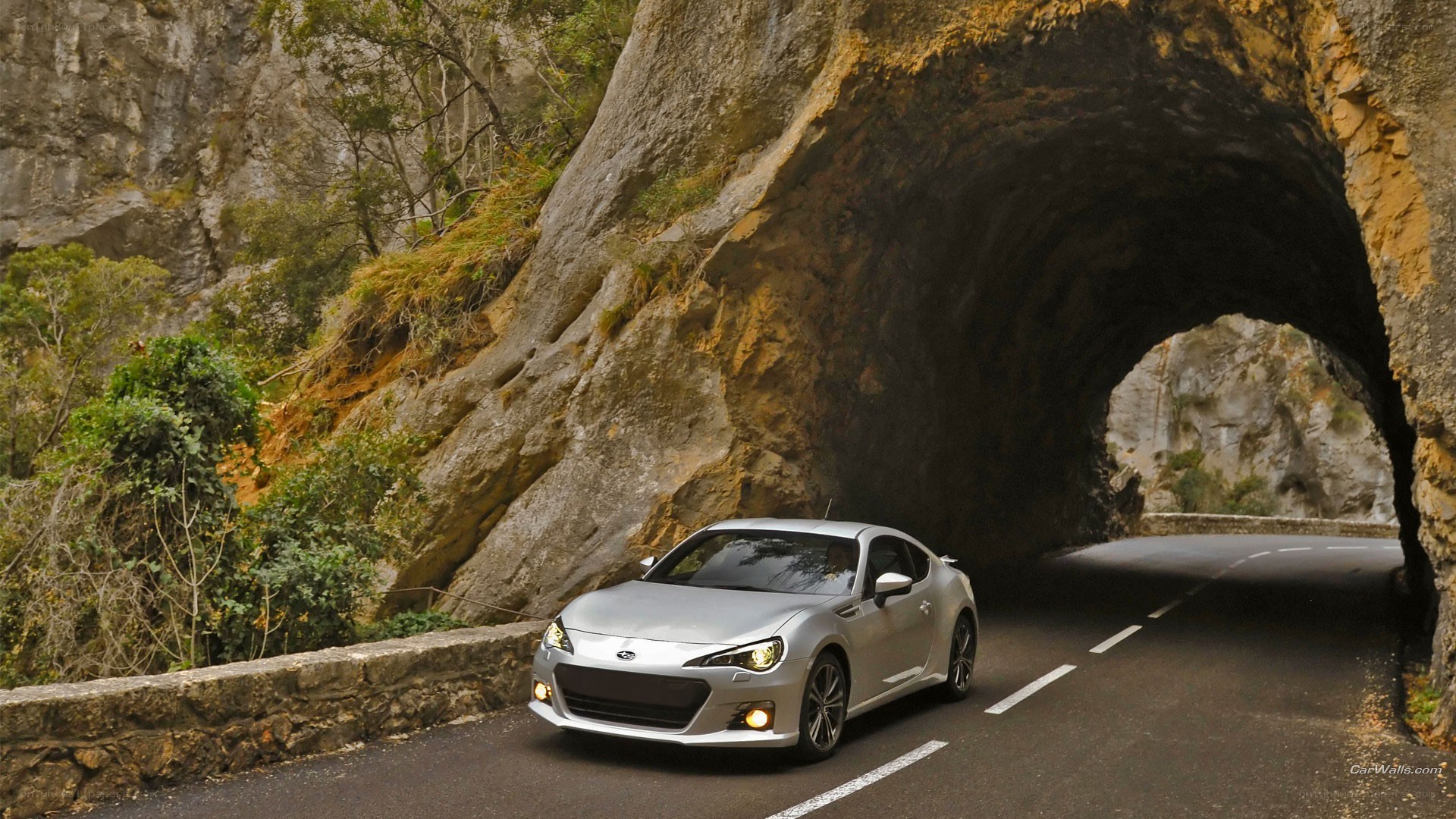 Silver car on mountain road