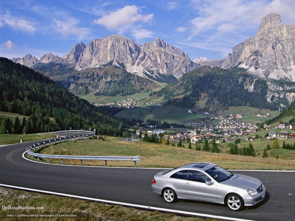 Silver car on mountain road