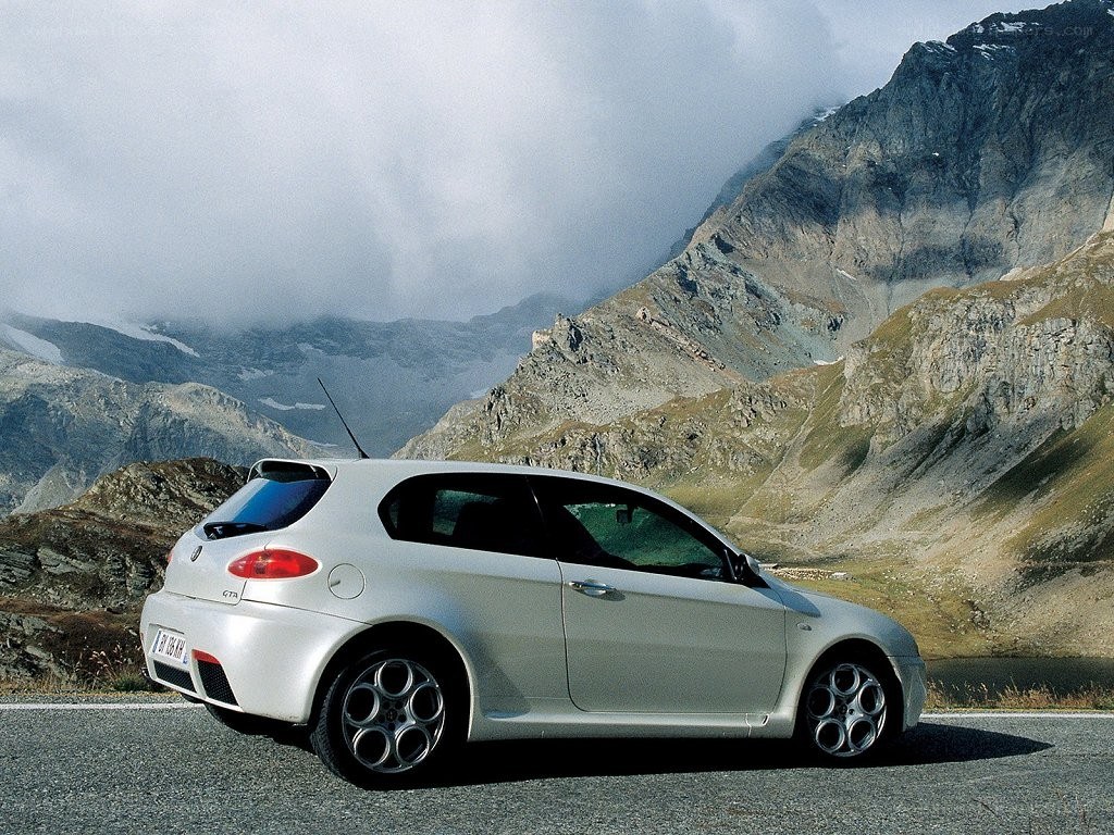 Silver car on mountain road