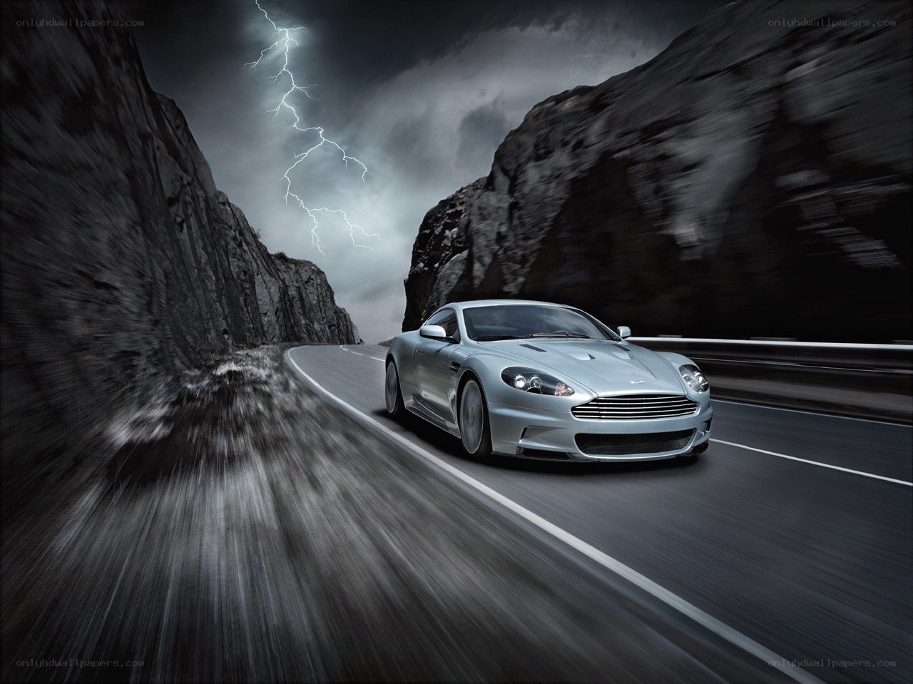 Silver car on mountain road