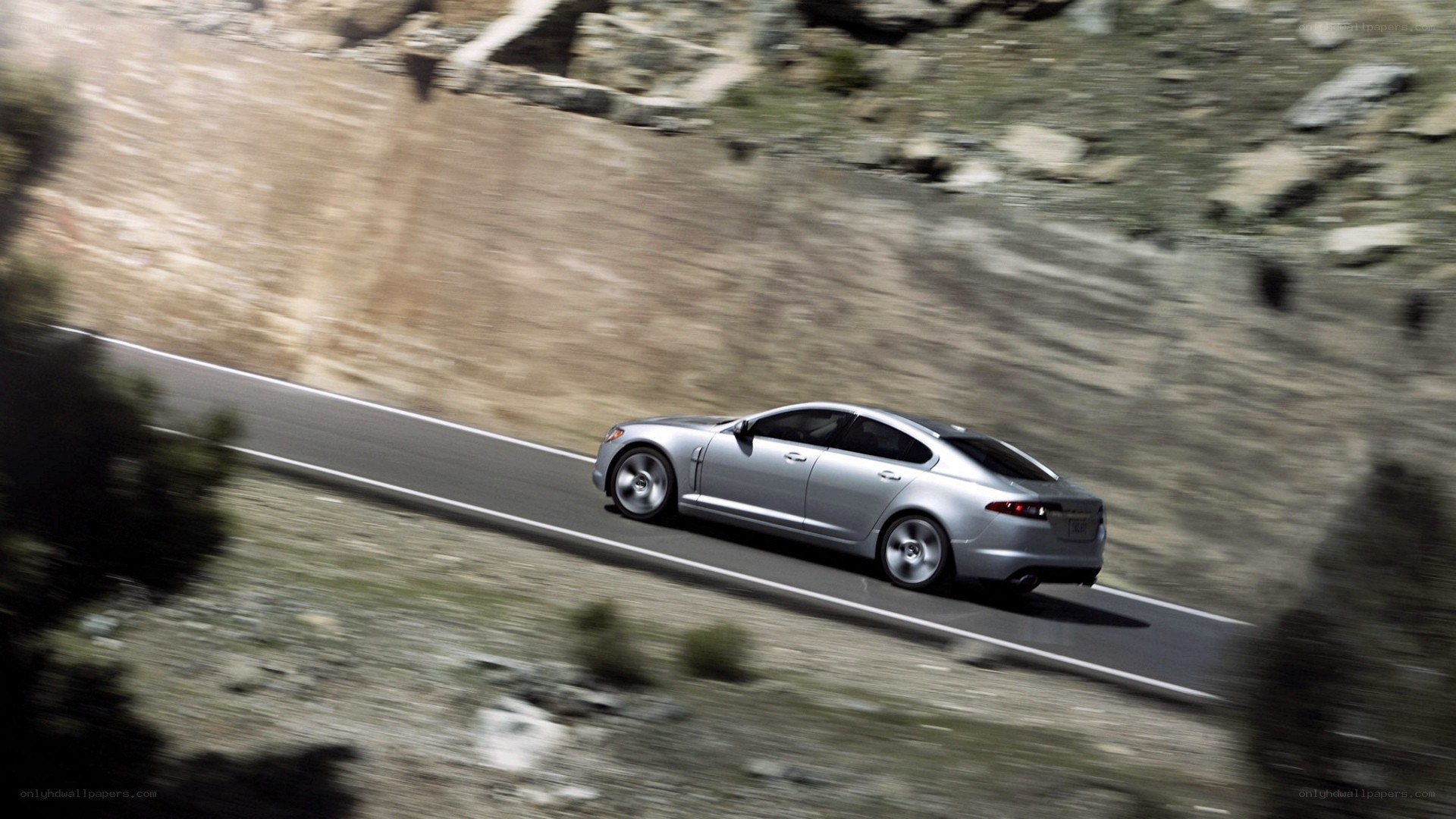 silver car on mountain road