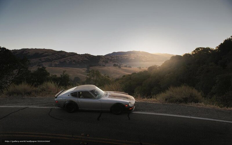 Silver car on mountain road