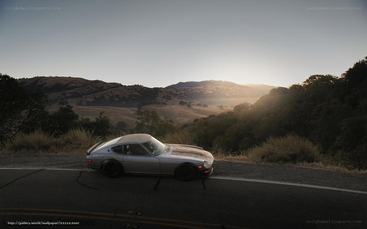 Silver car on mountain road