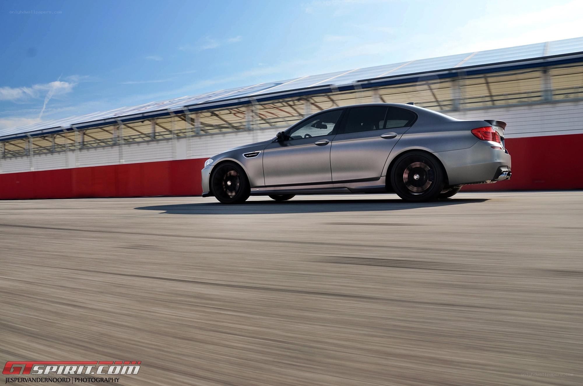 silver car on racetrack