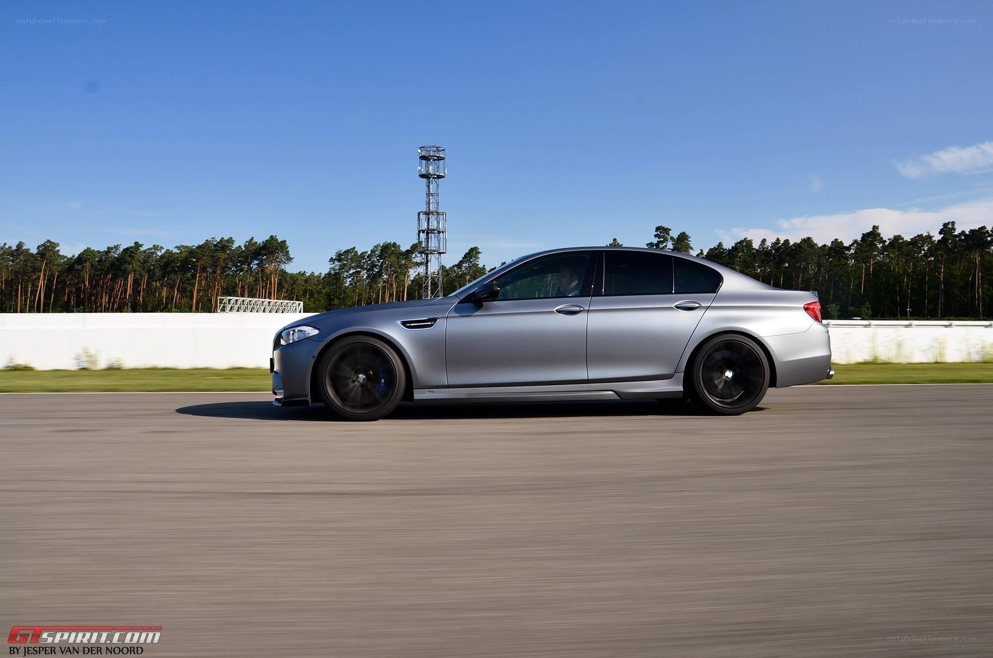 silver car on racetrack