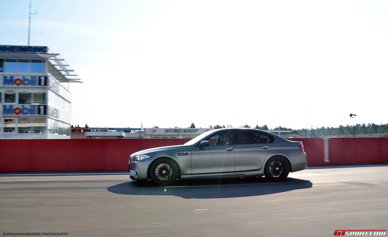 silver car on racetrack