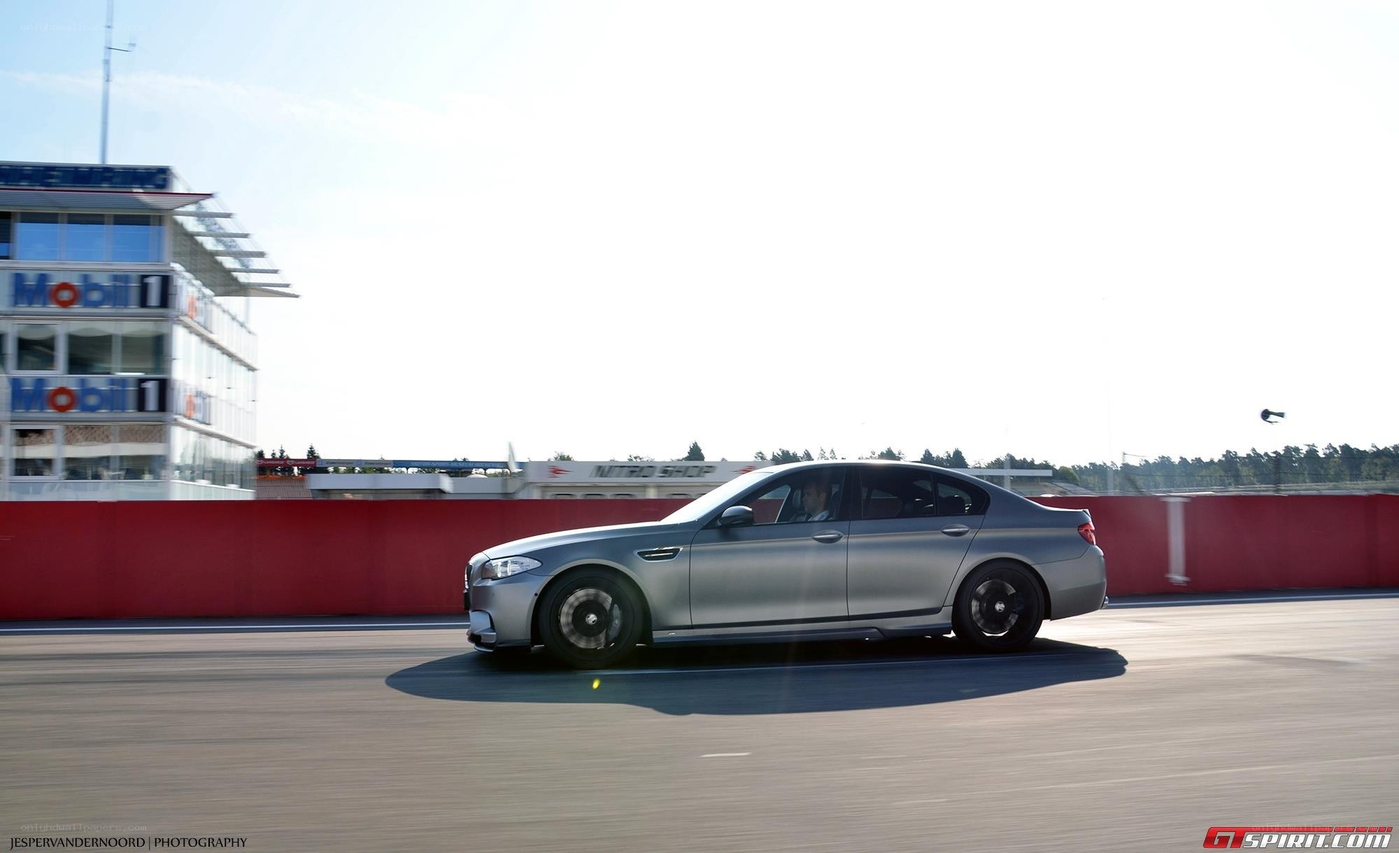 silver car on racetrack