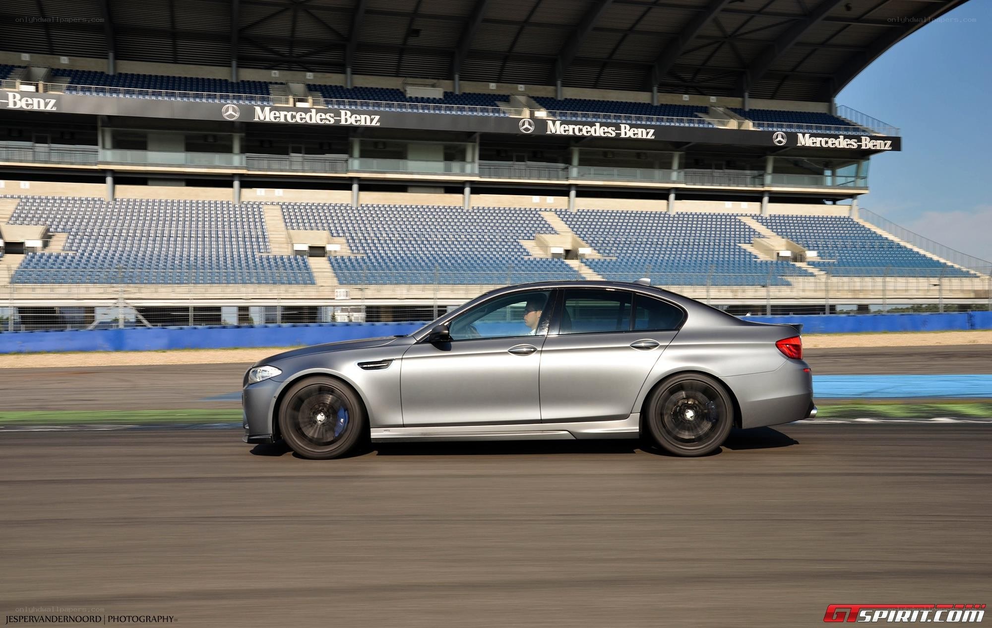 silver car on racetrack