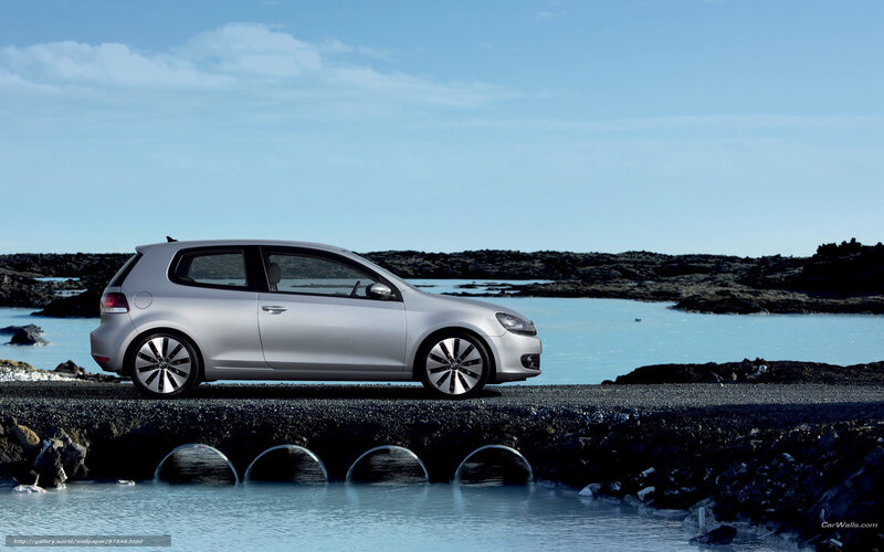 Silver car on rocky shore