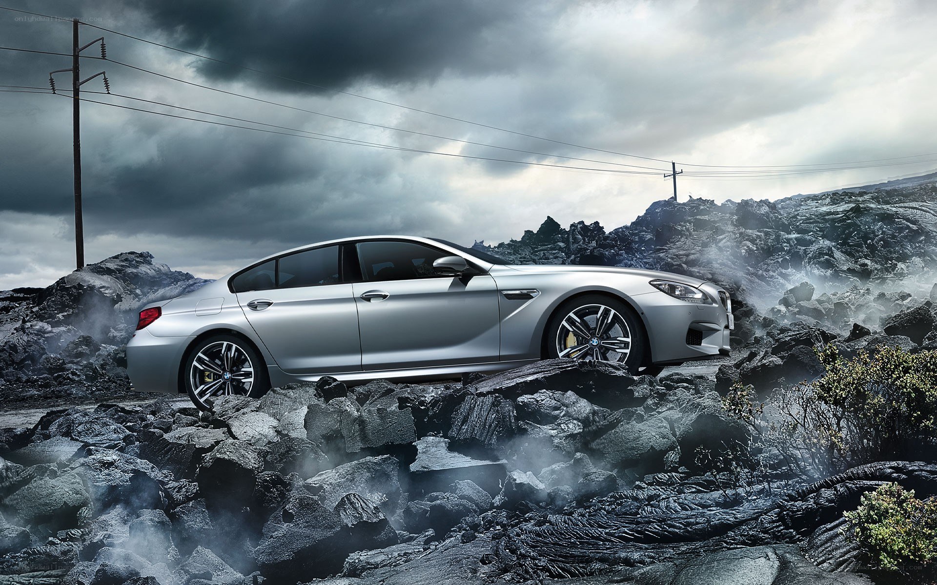 Silver car on rocky terrain