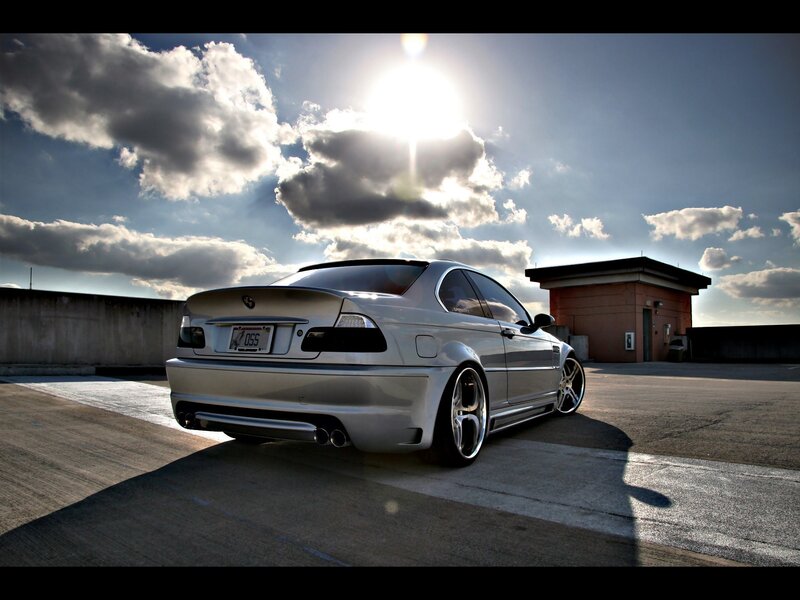 silver car on rooftop at sunset