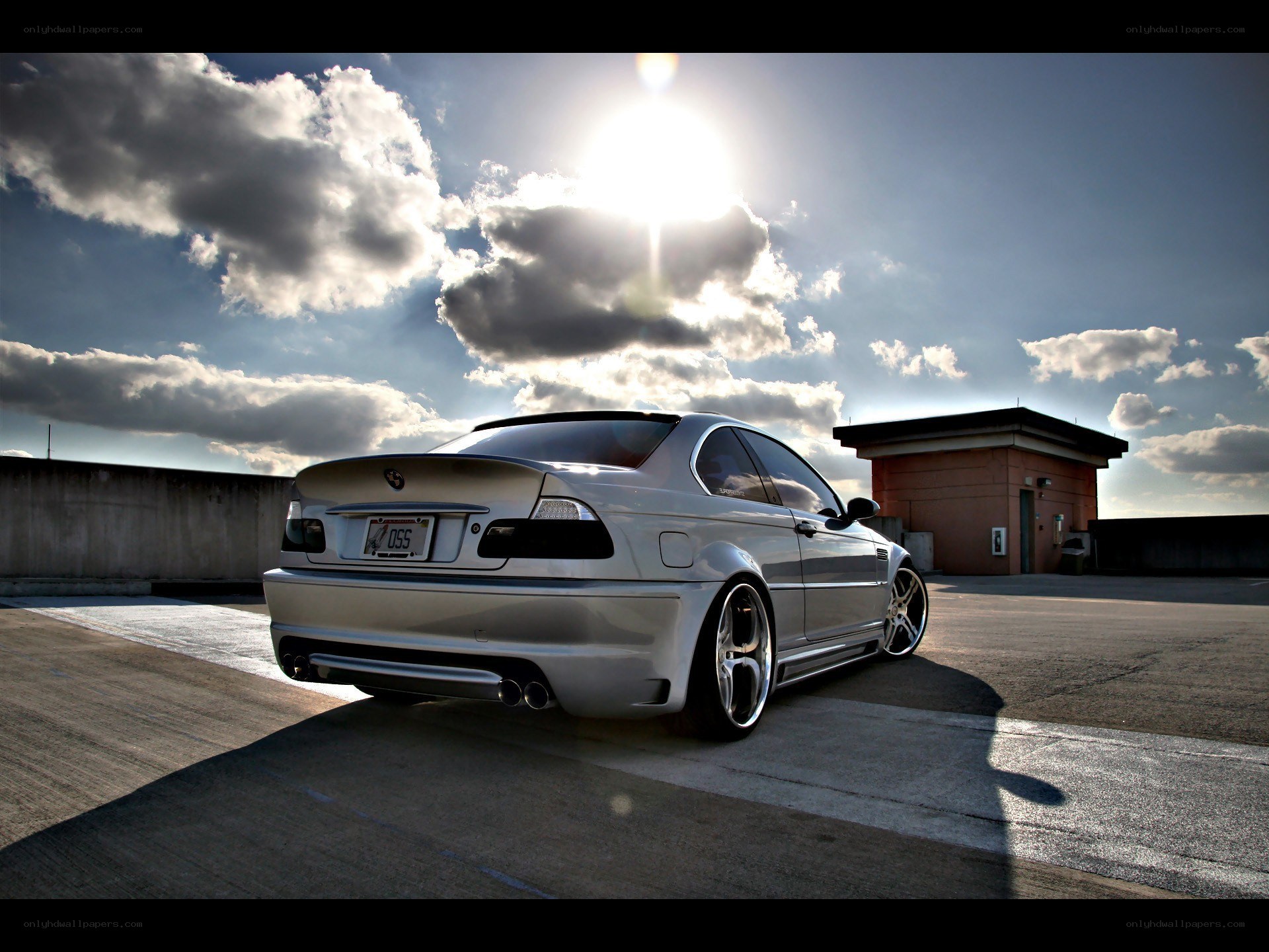 silver car on rooftop at sunset