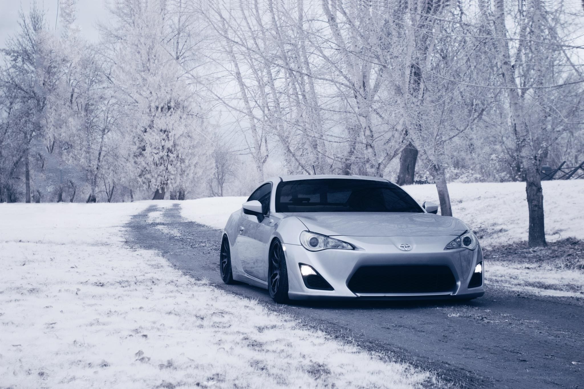 Silver car on snowy road