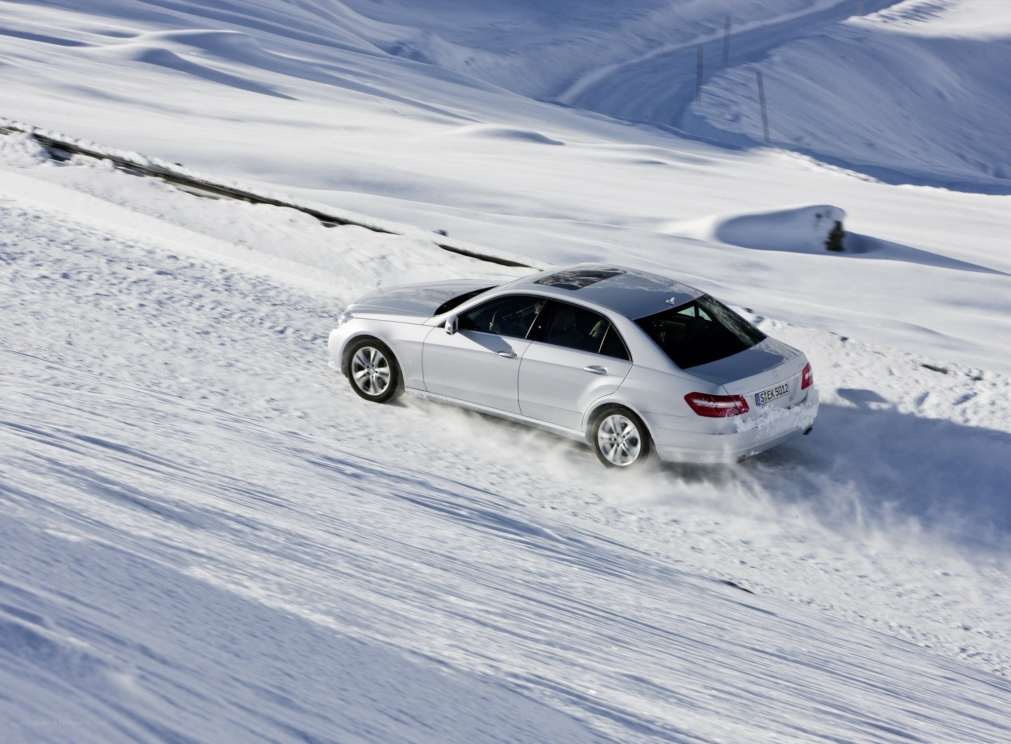 Silver car on snowy road