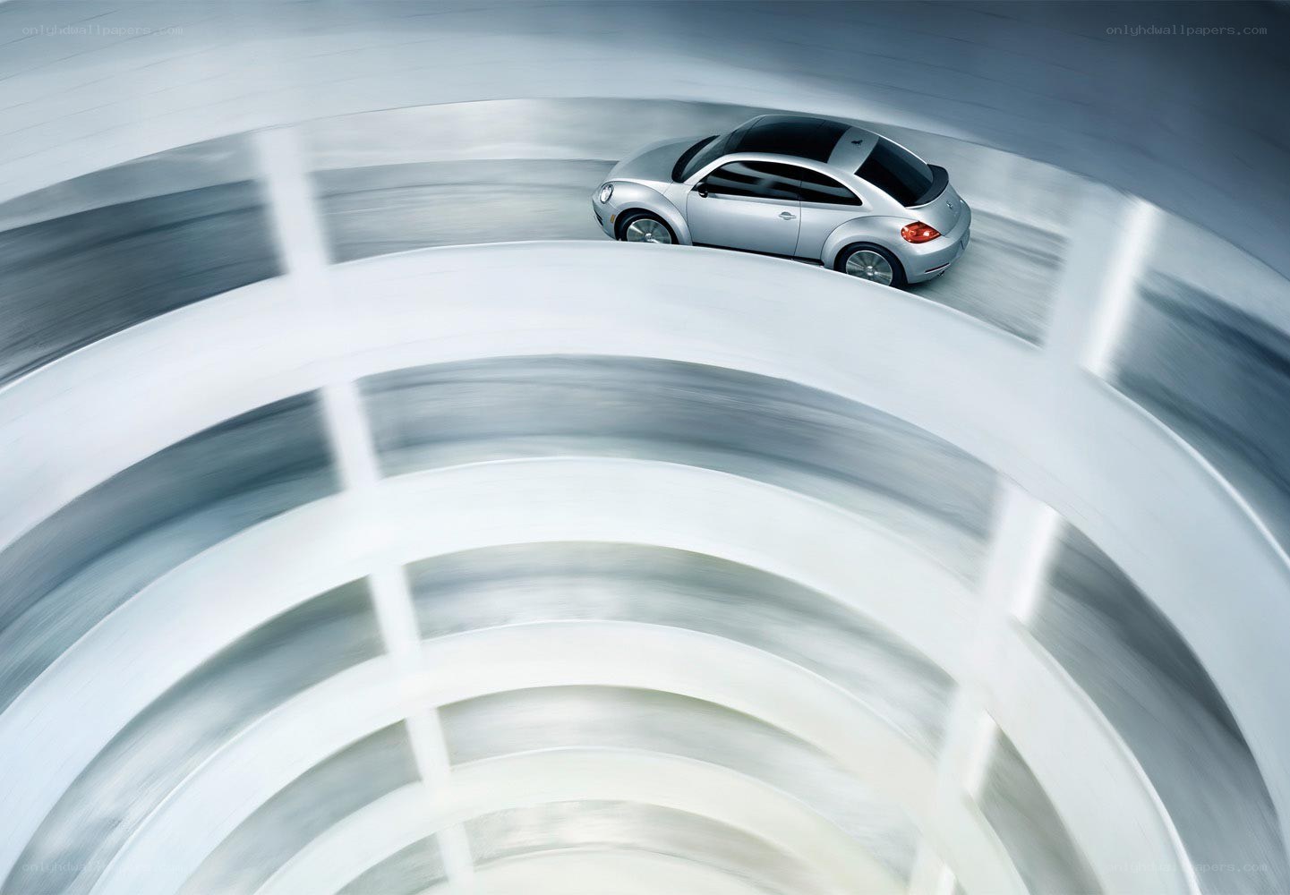 Silver car on spiral track