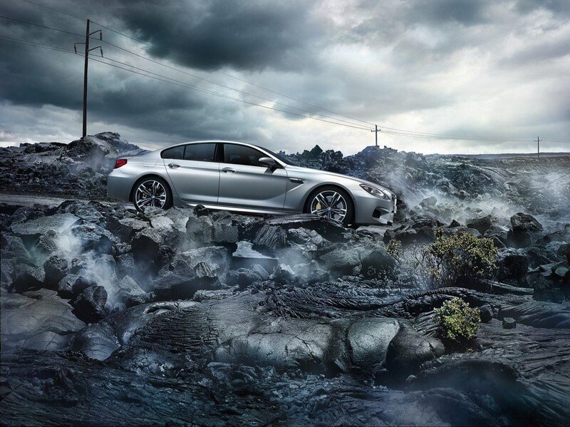 Silver car on volcanic terrain