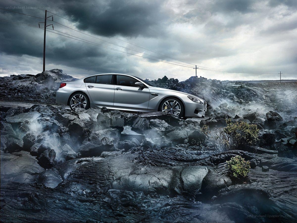 Silver car on volcanic terrain