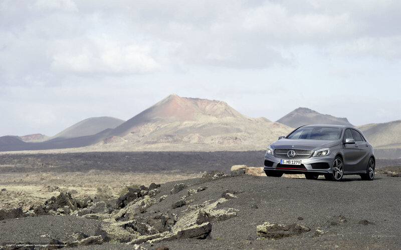 Silver Car on Volcanic Terrain — Gray, Dramatic