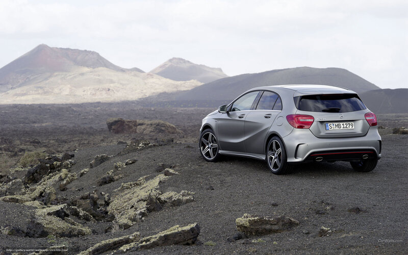 silver car on volcanic terrain