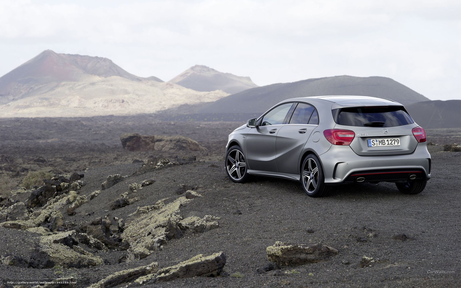 silver car on volcanic terrain
